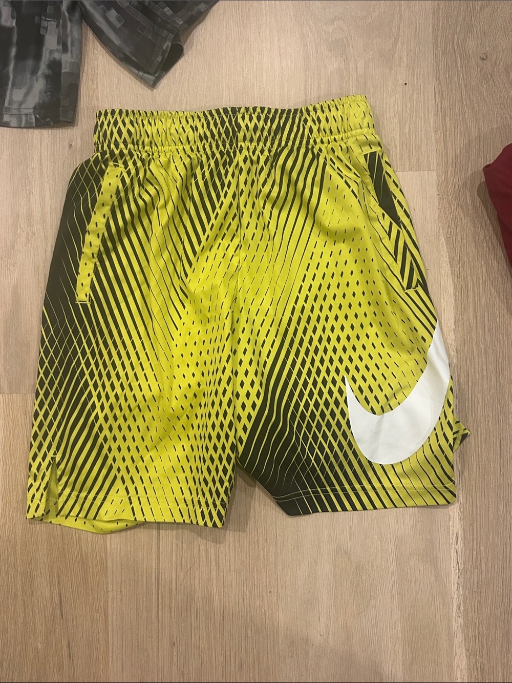 Nike Boys Yellow and Black Graphic Athletic Shorts (Medium)